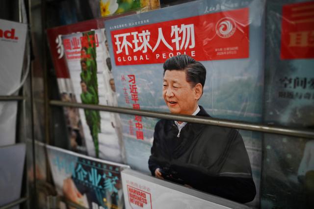 A magazine featuring a profile of Chinese President Xi Jinping is seen at a news stand on March 5, 2026, as the opening session of the National People’s Congress, the annual meeting of China’s legislature, was being held in Beijing. (Photo by GREG BAKER / AFP)