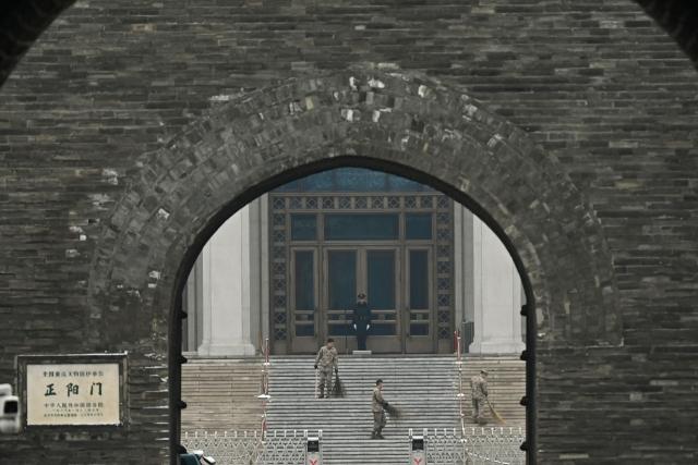 A Chinese paramilitary policeman guards the Mausoleum of late communist leader Mao Zedong near the Great Hall of the People, venue for the opening session of the National People's Congress (NPC), in Beijing on March 5, 2026. (Photo by Pedro PARDO / AFP)