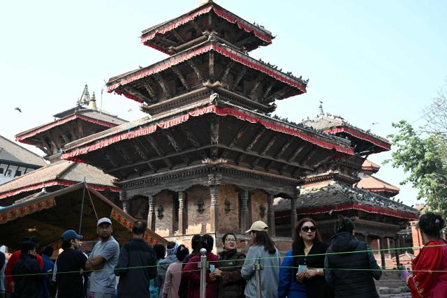 People wait in a queue to cast their ballot at a polling station during Nepal's parliamentary election in Kathmandu on March 5, 2026. Nepal voted on March 5 for a new parliament in a high-stakes showdown between an entrenched old guard and a powerful youth movement, six months after deadly anti-corruption protests toppled the government. (Photo by TAUSEEF MUSTAFA / AFP)