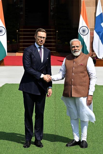 India's Prime Minister Narendra Modi (R) shakes hands with Finland’s President Alexander Stubb (L) before their meeting at the Hyderabad House in New Delhi on March 5, 2026. (Photo by Sajjad  HUSSAIN / AFP)