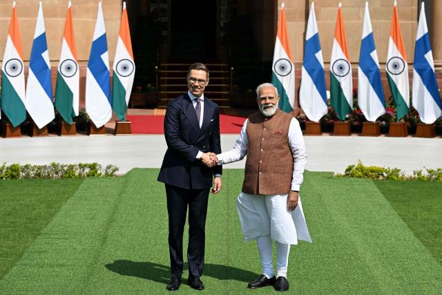 India's Prime Minister Narendra Modi (R) shakes hands with Finland’s President Alexander Stubb (L) before their meeting at the Hyderabad House in New Delhi on March 5, 2026. (Photo by Sajjad  HUSSAIN / AFP)