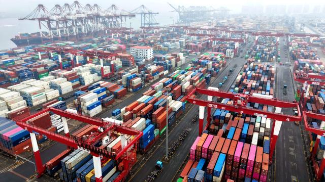 Cargo containers are seen at a port in Qingdao, eastern China's Shandong province on March 5, 2026. (Photo by CN-STR / AFP) / China OUT