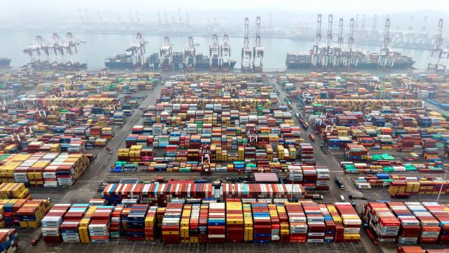 Cargo containers are seen at a port in Qingdao, eastern China's Shandong province on March 5, 2026. (Photo by CN-STR / AFP) / China OUT