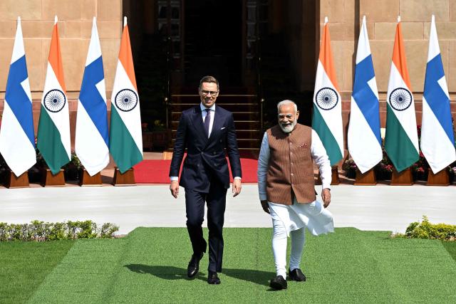India's Prime Minister Narendra Modi (R) walks with Finland’s President Alexander Stubb (L) before their meeting at the Hyderabad House in New Delhi on March 5, 2026. (Photo by Sajjad  HUSSAIN / AFP)