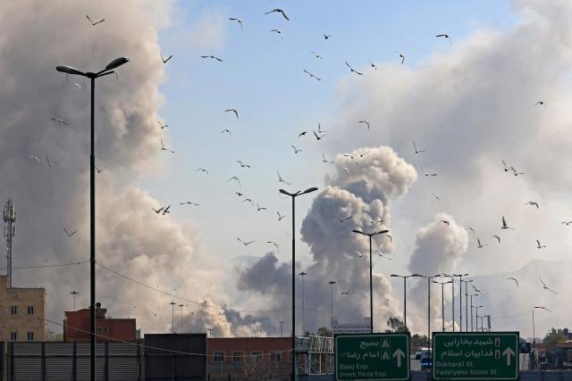 A plume of smoke rises after a strike on the Iranian capital of Tehran on March 5, 2026. Israel pounded Tehran with fresh strikes and Iran targeted Kurdish guerilla groups in Iraq on March 5 as a spiralling war in the Middle East engulfed the entire region. (Photo by Atta KENARE / AFP)