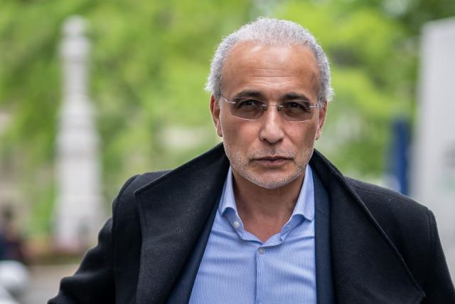 (FILES) Swiss leading Islamic scholar Tariq Ramadan arrives at the Geneva court house on May 24, 2023, for the verdict of his trial for "rape and sexual coercion" in a case dating back 15 years. The Paris departmental criminal court once again extends the suspension of the rape trial of Swiss Islamic scholar Tariq Ramadan on March 5, 2026, as the requested medical assessment has not yet been submitted. (Photo by FABRICE COFFRINI / AFP)