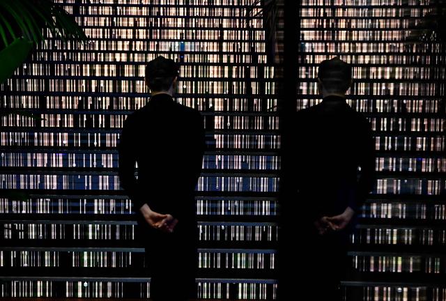 A man walks during the opening of a Google AI-Centre in Berlin on March 5, 2026. Google opens an AI centre in Berlin, the latest sign of Europe's deepening reliance on US firms in cutting edge technologies despite the continent's stated aim to catch up with its rivals. Germany's ministry for digital affairs told AFP the centre will bring together cloud computing and data infrastructure, "AI development" operations as well as a space for cooperation between start-ups and research centres. (Photo by Tobias SCHWARZ / AFP)