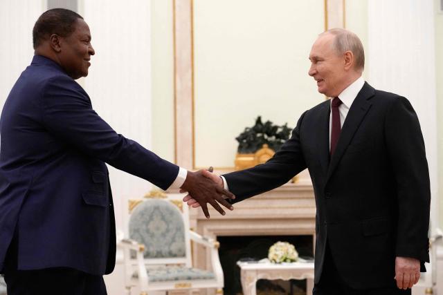 Russian President Vladimir Putin, (R) and Central African Republic President Faustin-Archange Touadera shake hands during their meeting at the Kremlin in Moscow on March 5, 2026. (Photo by Alexander Zemlianichenko / POOL / AFP)