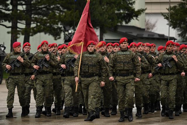 Members of the Kosovo Security Force (KSF) take part in a ceremony marking the 28th anniversary of the killing of Kosovo Liberation Army (KLA) founding member and commander Adem Jashari, in Pristina on March 5, 2026. Jashari, seen as the "father of the KLA", was among 45 members of his family killed by Serb security forces in the village of Prekaz some 50 km west of the Kosovo capital Pristina, sparking a full-blown rebel insurgency. (Photo by Armend NIMANI / AFP)