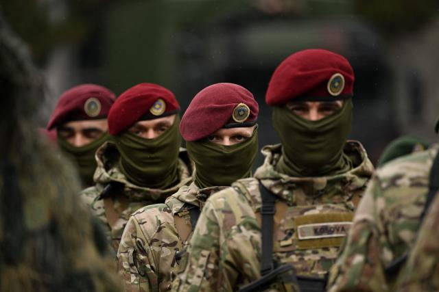 Members of the Kosovo Security Force (KSF) take part in a ceremony marking the 28th anniversary of the killing of Kosovo Liberation Army (KLA) founding member and commander Adem Jashari, in Pristina on March 5, 2026. Jashari, seen as the "father of the KLA", was among 45 members of his family killed by Serb security forces in the village of Prekaz some 50 km west of the Kosovo capital Pristina, sparking a full-blown rebel insurgency. (Photo by Armend NIMANI / AFP)