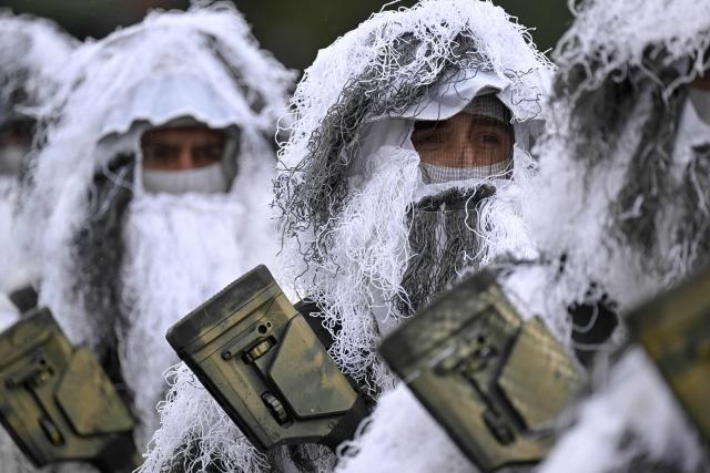 Members of the Kosovo Security Force (KSF) take part in a ceremony marking the 28th anniversary of the killing of Kosovo Liberation Army (KLA) founding member and commander Adem Jashari, in Pristina on March 5, 2026. Jashari, seen as the "father of the KLA", was among 45 members of his family killed by Serb security forces in the village of Prekaz some 50 km west of the Kosovo capital Pristina, sparking a full-blown rebel insurgency. (Photo by Armend NIMANI / AFP)