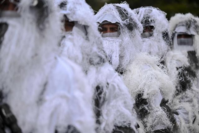 Members of the Kosovo Security Force (KSF) take part in a ceremony marking the 28th anniversary of the killing of Kosovo Liberation Army (KLA) founding member and commander Adem Jashari, in Pristina on March 5, 2026. Jashari, seen as the "father of the KLA", was among 45 members of his family killed by Serb security forces in the village of Prekaz some 50 km west of the Kosovo capital Pristina, sparking a full-blown rebel insurgency. (Photo by Armend NIMANI / AFP)