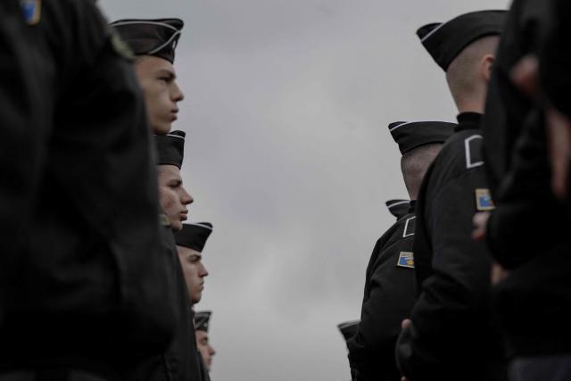 Members of the Kosovo Security Force (KSF) take part in a ceremony marking the 28th anniversary of the killing of Kosovo Liberation Army (KLA) founding member and commander Adem Jashari, in Pristina on March 5, 2026. Jashari, seen as the "father of the KLA", was among 45 members of his family killed by Serb security forces in the village of Prekaz some 50 km west of the Kosovo capital Pristina, sparking a full-blown rebel insurgency. (Photo by Armend NIMANI / AFP)