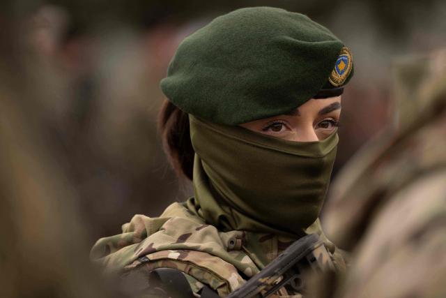 A member of the Kosovo Security Force (KSF) takes part in a ceremony marking the 28th anniversary of the killing of Kosovo Liberation Army (KLA) founding member and commander Adem Jashari, in Pristina on March 5, 2026. Jashari, seen as the "father of the KLA", was among 45 members of his family killed by Serb security forces in the village of Prekaz some 50 km west of the Kosovo capital Pristina, sparking a full-blown rebel insurgency. (Photo by Armend NIMANI / AFP)