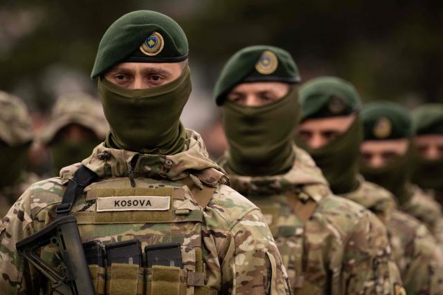 Members of the Kosovo Security Force (KSF) take part in a ceremony marking the 28th anniversary of the killing of Kosovo Liberation Army (KLA) founding member and commander Adem Jashari, in Pristina on March 5, 2026. Jashari, seen as the "father of the KLA", was among 45 members of his family killed by Serb security forces in the village of Prekaz some 50 km west of the Kosovo capital Pristina, sparking a full-blown rebel insurgency. (Photo by Armend NIMANI / AFP)