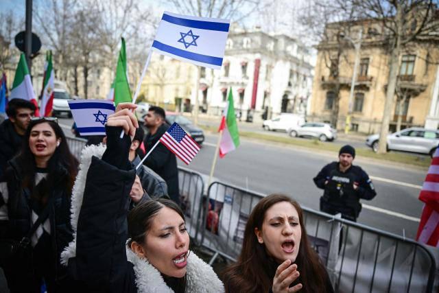 Members of the Iranian community to Romania attend a protest in front of the Iranian Embassy in Bucharest on March 5, 2026. Around one hundred participants held placards and chanted slogans in support of Israeli-US strikes on Iran and for the son of the last Shah of Iran, Reza Pahlavi, the most prominent figure in the Iranian opposition in exile. (Photo by Daniel MIHAILESCU / AFP)