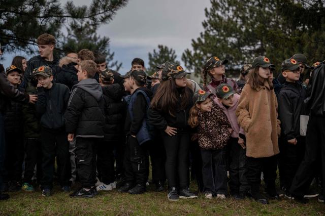 Kids wearing caps with the emblem of the Kosovo Security Force (KSF) take part in a ceremony marking the 28th anniversary of the killing of Kosovo Liberation Army (KLA) founding member and commander Adem Jashari, in Pristina on March 5, 2026. Jashari, seen as the "father of the KLA", was among 45 members of his family killed by Serb security forces in the village of Prekaz some 50 km west of the Kosovo capital Pristina, sparking a full-blown rebel insurgency. (Photo by Armend NIMANI / AFP)