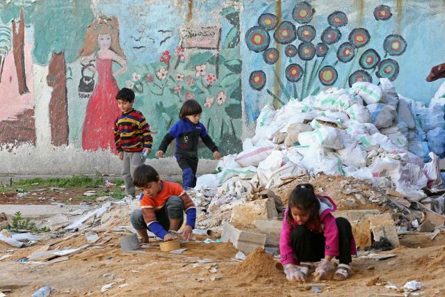 Displaced Lebanese children play inside the compound of a school transformed into a shelter in the southern coastal city of Sidon on March 5, 2026. Israeli strikes killed eight people in Lebanon on March 5 as Israel renewed its evacuation call for vast areas of the country's south, long a stronghold of Hezbollah. (Photo by MAHMOUD ZAYYAT / AFP)