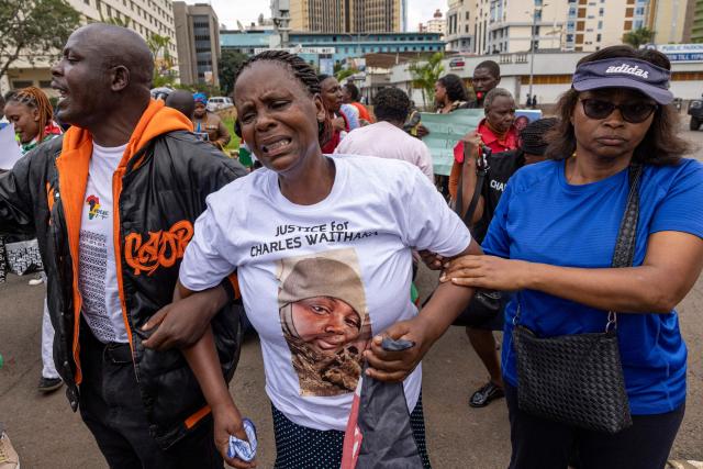 Relatives of Kenyan nationals, that was duped into fighting for the Russian army in Ukraine, react as they stage a sit in outside the parliament buildings during a peaceful demonstration demanding urgent government action to repatriate their kin, in Nairobi on March 5, 2026. More than 1000 Kenyans have gone to fight for the Russian army in Ukraine, most of them tricked into signing military contracts, according to an intelligence report presented to Kenya's parliament. (Photo by SIMON MAINA / AFP)