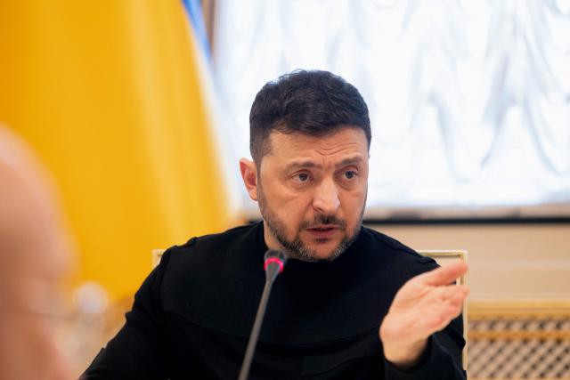 Ukraine's President Volodymyr Zelensky gestures as he addresses the audience during a briefing following a working meeting with Ukraine's Prime minister and the cabinet in Kyiv on March 5, 2026, amid the Russian invasion of Ukraine. (Photo by Tetiana DZHAFAROVA / AFP)
