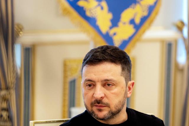 Ukraine's President Volodymyr Zelensky gestures looks on during a briefing following a working meeting with Ukraine's Prime minister and the cabinet in Kyiv on March 5, 2026, amid the Russian invasion of Ukraine. (Photo by Tetiana DZHAFAROVA / AFP)