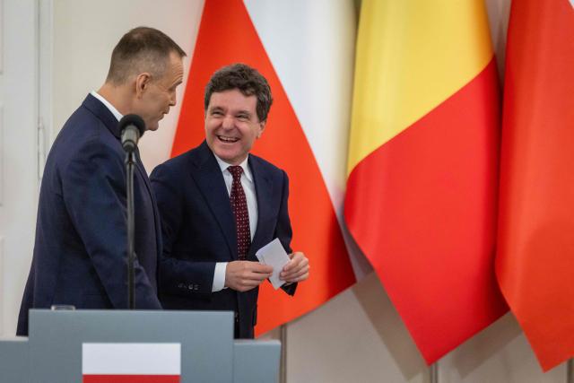 Poland's President Karol Nawrocki (L) and Romania's President Nicusor Dan (R) chat after a joint press conference at the Presidential Palace in Warsaw on March 5, 2026. (Photo by Wojtek RADWANSKI / AFP)