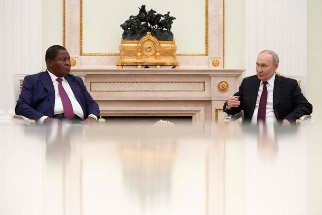 Russian President Vladimir Putin (R) greets Central African Republic President Faustin Archange Touadera at the Kremlin in Moscow on March 5, 2026. (Photo by Alexander Zemlianichenko / POOL / AFP)