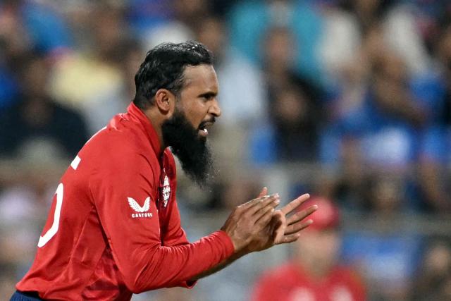 England's Adil Rashid gestures during the 2026 ICC Men's T20 Cricket World Cup semi-final match between India and England at the Wankhede Stadium in Mumbai on March 5, 2026. (Photo by Indranil MUKHERJEE / AFP)