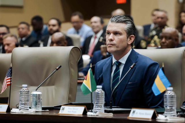 US Secretary of Defense Pete Hegseth listens during the inaugural Americas Counter Cartel Conference at the US Southern Command (SOUTHCOM) headquarters in Doral, Florida on March 5, 2026. Defense and security leaders from across the Caribbean, Central America, and South America gathered for the conference to strengthen regional cooperation in combating transnational criminal organizations and narcotics trafficking in the Western Hemisphere. (Photo by Eva Marie UZCATEGUI / AFP)