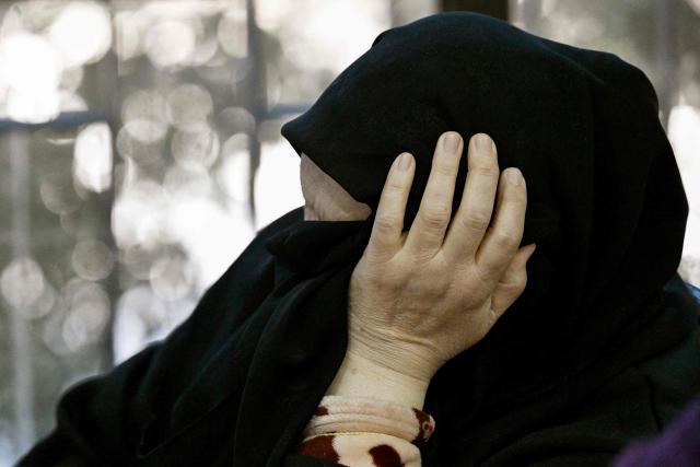 A woman sits at a school transformed into a shelter for displaced people in the town of Dekwaneh north of Beirut on March 5, 2026. Israel bombarded Lebanon on March 2, expanding the conflict across the region after the massive Israel-US attack on Iran that the US president launched to topple Tehran's ruling clerics, and killing their supreme leader on February 28. (Photo by Joseph EID / AFP)