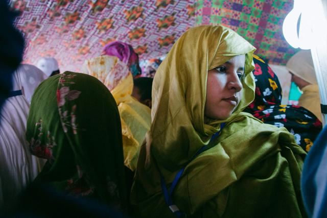 (FILES) A woman waits for the arrival of Mauritania's Minister of Social, Child and Family Affairs Neina Kane during her visit to Atar, northwestern Mauritania on International Women's Day on March 8, 2020. The International Women's Rights Day will fall on March 8, 2026. (Photo by Carmen Abd Ali / AFP)