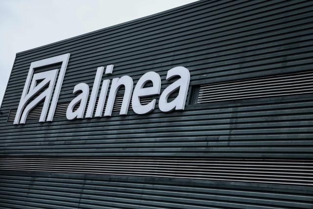 (FILES) This photograph shows the logo of Alinea - a furniture retailer - in Aubagne, south-eastern France on February 14, 2026. The furniture retailer Alinea (1,200 employees), which is under court-ordered restructuring, received a single overall takeover bid on March 5, 2026 from a Romanian group, which has pledged to keep half of the staff and 20 of its 36 stores—a proposal that employees consider “disgraceful. (Photo by Thibaud MORITZ / AFP)