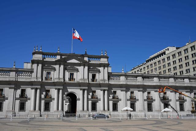 Workers prepare La Moneda Palace ahead of the arrival of the new President Jose Antonio Kast, in Santiago on March 5, 2026. Chile's presidential palace La Moneda is being prepared to serve as a residence again after nearly 70 years, with president-elect Jose Antonio Kast scheduled to move in on March 11. Kast will be the first head of state to live in the neoclassical Santiago landmark since 1958. (Photo by Rodrigo ARANGUA / AFP)