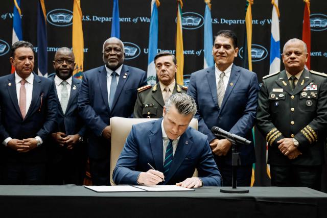 US Secretary of Defense Pete Hegseth signs the Americas Counter Cartel Conference Joint Security Declaration during the inaugural Americas Counter Cartel Conference at the US Southern Command (SOUTHCOM) headquarters in Doral, Florida on March 5, 2026. (Photo by Eva Marie UZCATEGUI / AFP)