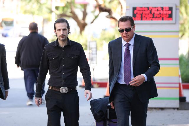 Plaintiff Tony Saxon (L) arrives as US rapper and producer Kanye West and Australian model Bianca Censori are to testify at Los Angeles Superior Court in the civil trial related to his Malibu mansion in Los Angeles, California, on March 5, 2026. West and Censori are testifying in the civil lawsuit filed by contractor Tony Saxon, who was hired in 2021 as a project manager/handyman to renovate the Malibu mansion, alleging unpaid wages, hazardous working conditions and wrongful termination. (Photo by Patrick T. Fallon / AFP)