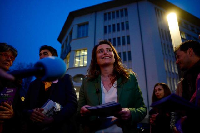 The National secretary of the left-wing party The Ecologistes Marine Tondelier distributes campaign leaflets to support the Mayor of Lyon and candidate for re-election in France's upcoming local elections Gregory Doucet, in Lyon, central eastern France on March 5, 2026. (Photo by Olivier CHASSIGNOLE / AFP)