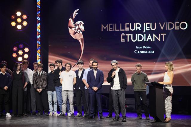 Students of ISART Digital Paris stand on stage as they are awarded the Best Students' Video Game award for "Candellum" during the 7th edition of the Pegases video game awards ceremony at La Cigale in Paris on March 5, 2026. (Photo by Dimitar DILKOFF / AFP)