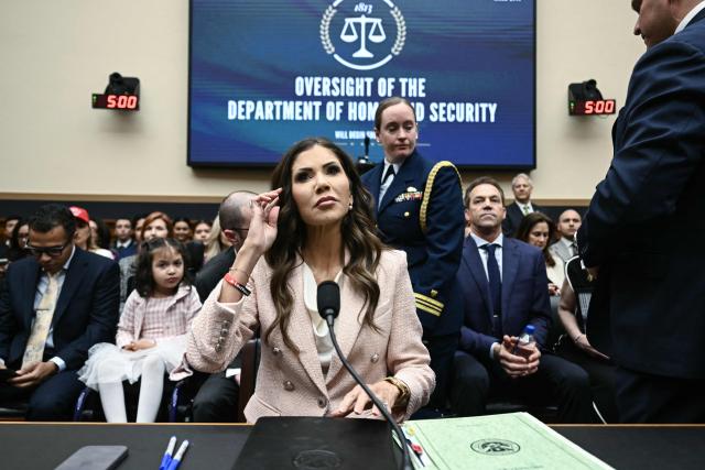 (FILES) US Secretary of Homeland Security Kristi Noem takes her seat as she arrives for a House Judiciary Committee hearing on oversight of the Department of Homeland Security on Capitol Hill in Washington, DC, on March 4, 2026. US President Donald Trump announced on March 5, 2026, that he was replacing Kristi Noem, head of the powerful Department of Homeland Security. Trump, in a post on Truth Social, said Oklahoma Senator Markwayne Mullen would take over from Noem at DHS on March 31. (Photo by Brendan SMIALOWSKI / AFP)