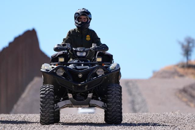 (FILES) US Secretary of Homeland Security Kristi Noem rides a four-wheeler during a tour along the Nogales border wall at the Mariposa Port of Entry in Nogales, Arizona, March 15, 2025. US President Donald Trump announced on March 5, 2026, that he was replacing Kristi Noem, head of the powerful Department of Homeland Security. Trump, in a post on Truth Social, said Oklahoma Senator Markwayne Mullen would take over from Noem at DHS on March 31. (Photo by Alex Brandon / POOL / AFP)