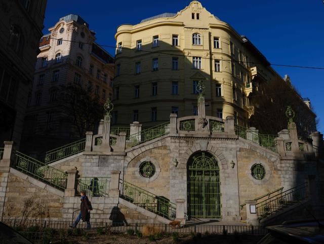 A woman walks past Fillgraderstiege notable staircase with art nouveau style at Laimgruben district in Vienna, Austria on a sunny day on March 5, 2026. (Photo by Joe Klamar / AFP)