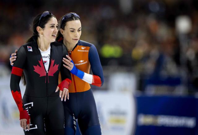 Canada's Beatrice Lamarche and Netherlands Femke Kok react after the women's 1000m sprint event during the 2026 ISU Speed Skating Allround and Sprint World Championships at the Thialf ice arena in Heerenveen, on March 5, 2026. (Photo by Sem van der Wal / ANP / AFP) / Netherlands OUT