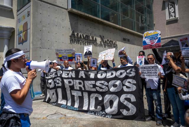 Relatives and friends of political prisoners protest outside the National Assembly building in Caracas on March 5, 2026, demanding the release of their loved ones. Venezuela enacted a historic amnesty law that was expected to lead to the release of hundreds of political prisoners, but experts say the measure is exclusionary and leaves many detainees at the mercy of those in power. (Photo by Maryorin Mendez / AFP)