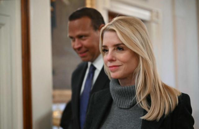 US Attorney General Pam Bondi walks in with former professional baseball player Alex Rodriguez to attend an event for Inter Miami CF, winners of the 2025 Major League Soccer Cup, in the East Room of the White House in Washington, DC, on March 5, 2026. (Photo by ANDREW CABALLERO-REYNOLDS / AFP)