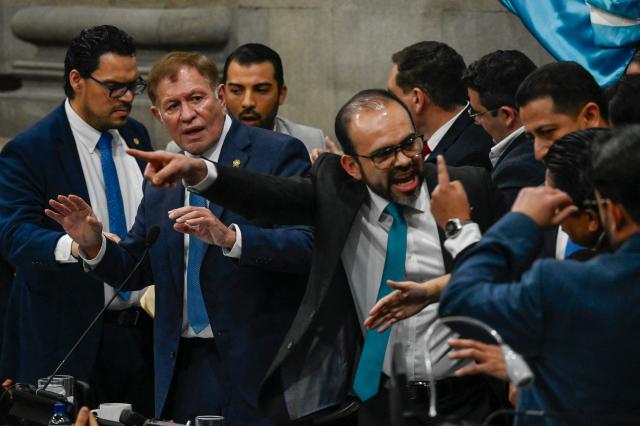 Guatemala's Congress president Luis Contreras (2nd L) calls the members of parliament to order, as some lawmakers argue, during a Congress session for the election of two magistrates for the Constitutional Court in Guatemala City on March 5, 2026. (Photo by JOHAN ORDONEZ / AFP)