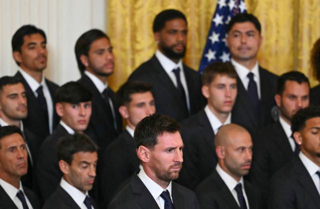 Inter Miami's Argentine forward Lionel Messi and teammates listen to US President Donald Trump speak during an event honoring the winners of the 2025 Major League Soccer Cup, in the East Room of the White House in Washington, DC, on March 5, 2026. (Photo by ANDREW CABALLERO-REYNOLDS / AFP)