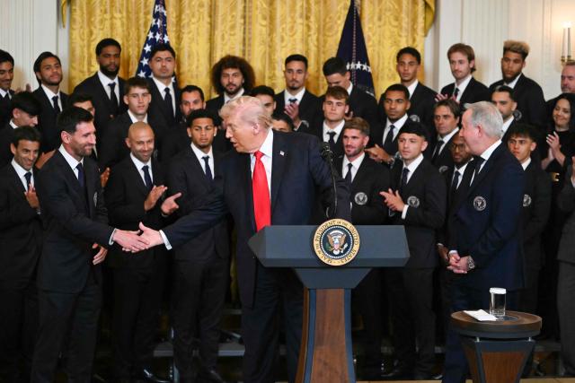 US President Donald Trump shakes hand with Argentinian star Lionel Messi during an event for Inter Miami CF, winners of the 2025 Major League Soccer Cup, in the East Room of the White House in Washington, DC, on March 5, 2026. (Photo by ANDREW CABALLERO-REYNOLDS / AFP)