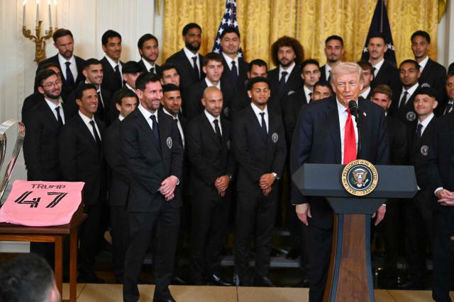 US President Donald Trump speaks next to Argentinian star Lionel Messi during an event for Inter Miami CF, winners of the 2025 Major League Soccer Cup, in the East Room of the White House in Washington, DC, on March 5, 2026. (Photo by ANDREW CABALLERO-REYNOLDS / AFP)