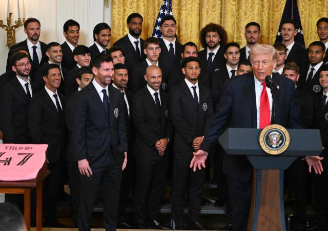US President Donald Trump speaks next to Argentinian star Lionel Messi during an event for Inter Miami CF, winners of the 2025 Major League Soccer Cup, in the East Room of the White House in Washington, DC, on March 5, 2026. (Photo by ANDREW CABALLERO-REYNOLDS / AFP)
