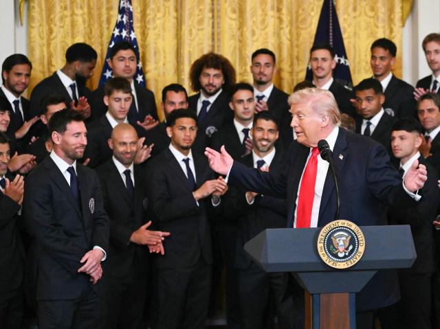 US President Donald Trump gestures to Argentinian star Lionel Messi (L) during an event for Inter Miami CF, winners of the 2025 Major League Soccer Cup, in the East Room of the White House in Washington, DC, on March 5, 2026. (Photo by ANDREW CABALLERO-REYNOLDS / AFP)