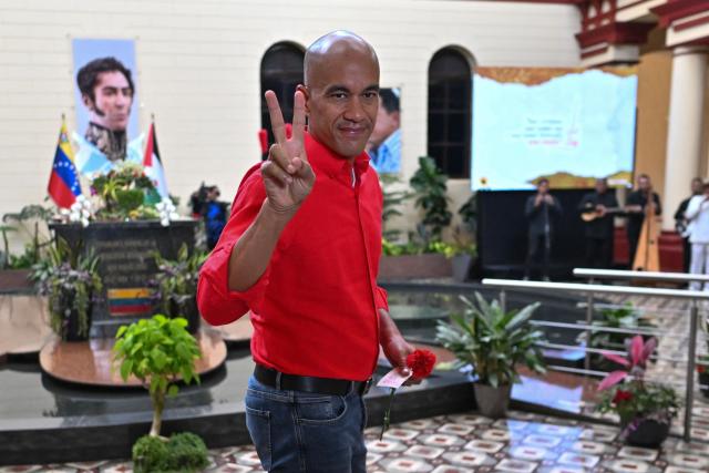 Venezuelan Minister of Education, Hector Rodriguez, gestures in front of the mausoleum of the former Venezuelan President Hugo Chavez at the 4F barracks in the 23 de Enero neighborhood in Caracas on March 5, 2026. (Photo by Juan BARRETO / AFP)